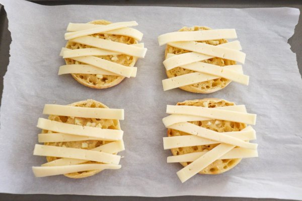 Halloween Garlic Toast with strips of cheese
