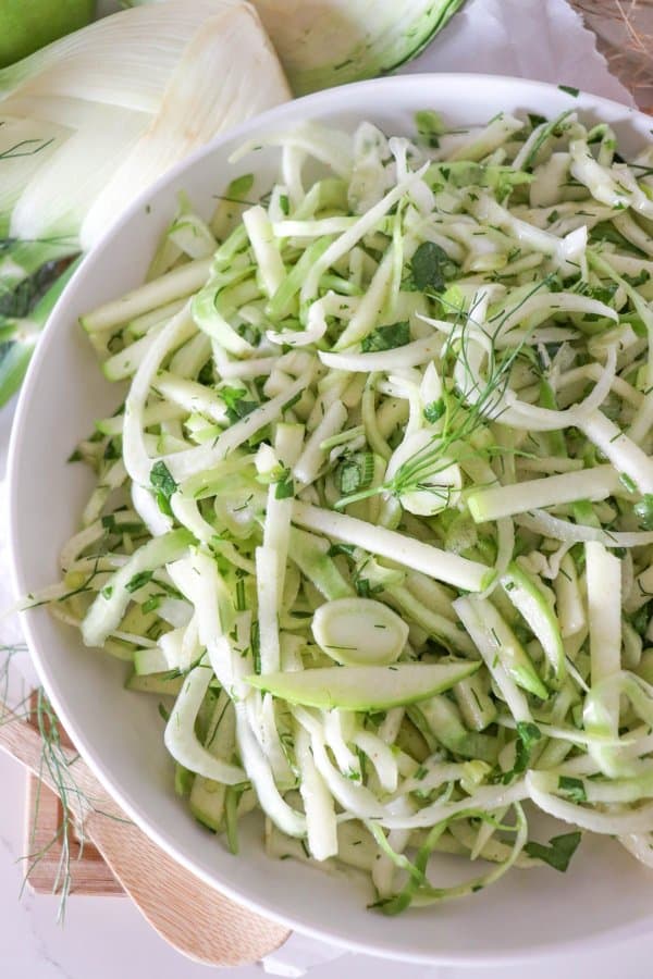 Fennel salad in a white bowl.