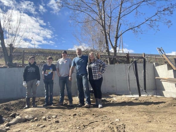 Family in Front of Concrete for Carriage House