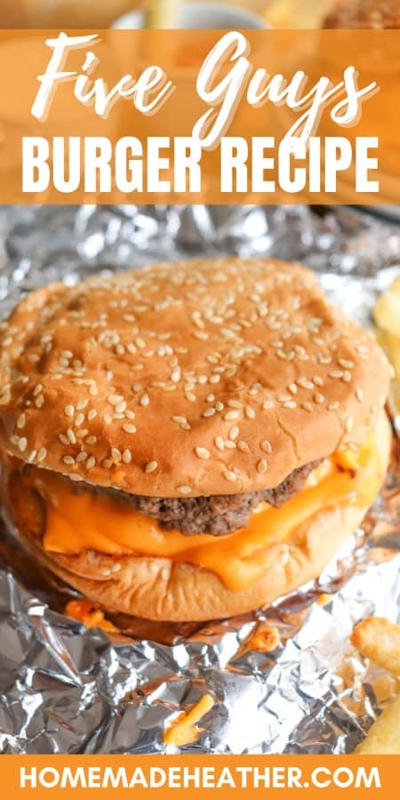 Copycat Five Guys Burger with melted American cheese and a sesame bun on foil.