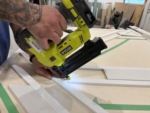 Nailing trim to plywood.