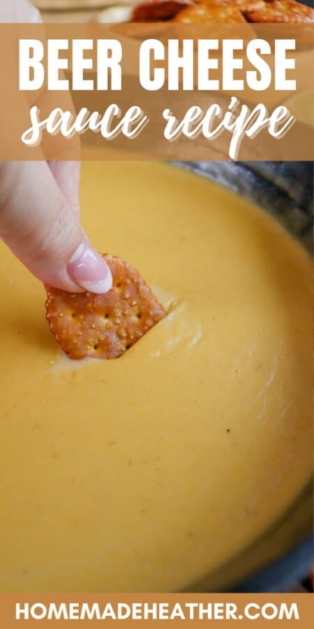 Fingers dipping a pretzel cracker into a cast iron skillet of beer cheese sauce with text overlay.