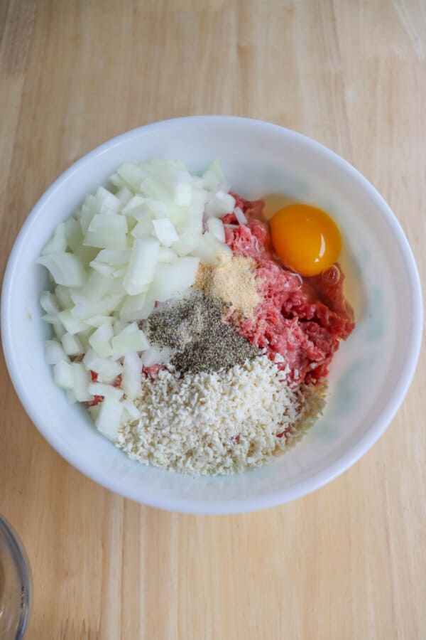Air fryer burger pattie ingredients in a bowl before mixing.