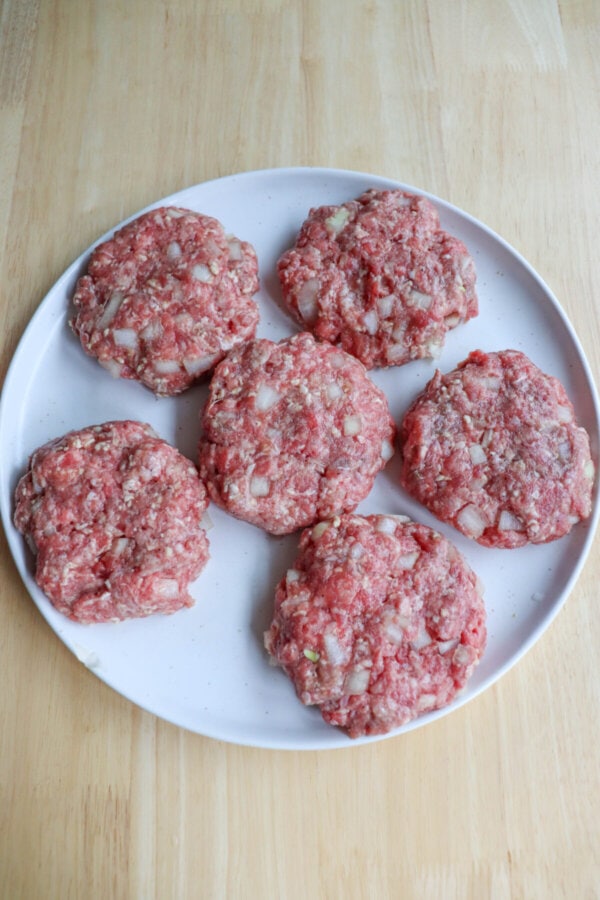 Air fryer burger patties are shaped and ready to be cooked.