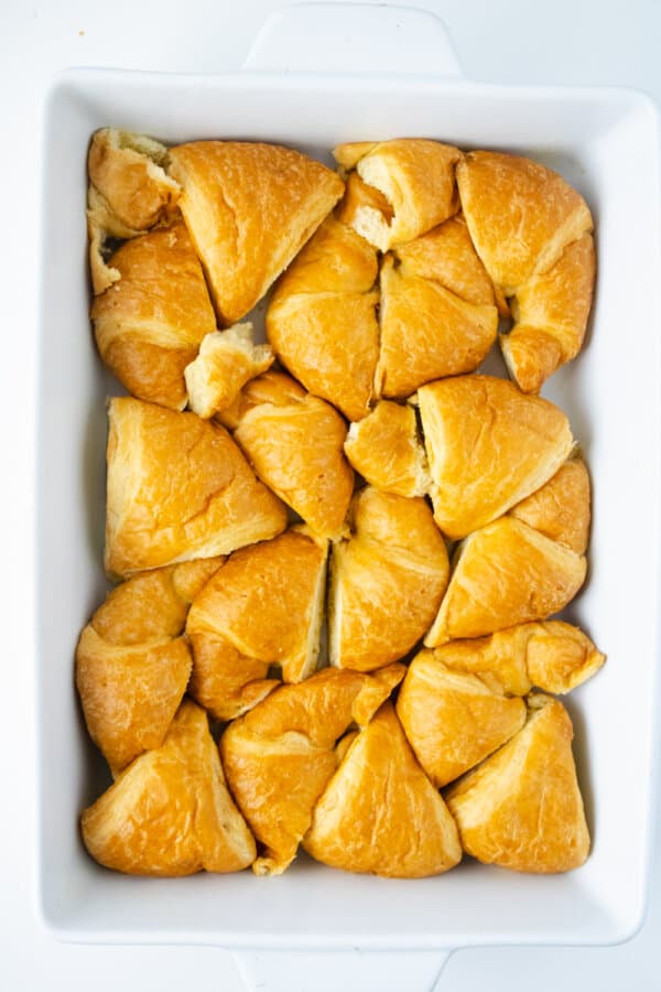 Croissants placed in casserole dish