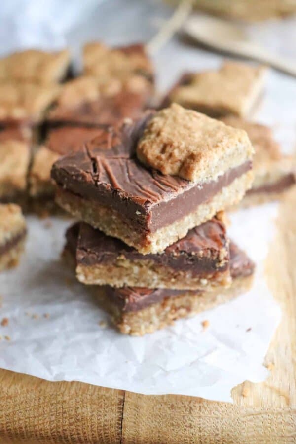 Starbucks Oat Bar stacked three high on parchment paper on a wooden surface.