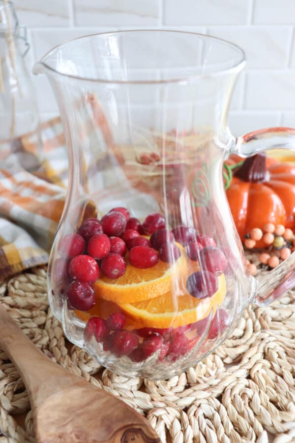 Fruit in a glass pitcher.