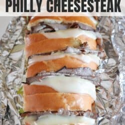 Philly cheesesteak sandwich french loaf on foil.