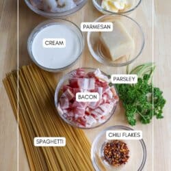 Spaghetti noodles in creamy white sauce with cooked shrimp, bacon bits and fresh parsley.