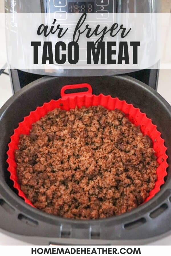 Ground beef seasoned with taco spices and cooked in the basket of an air fryer with a red liner.