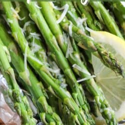 Asparagus spears topped with lemon slices and shredded mozzarella in a foil packet.