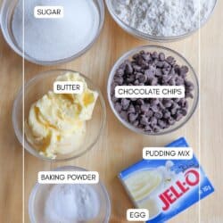 Chocolate chip pudding cookie ingredients in clear glass bowls on a wooden table.