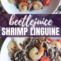 Purple and white linguine noodles in a cream sauce topped with shrimp and cherry tomatoes.