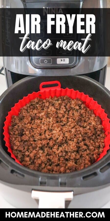 Ground beef seasoned with taco spices and cooked in the basket of an air fryer with a red liner.