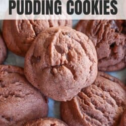 Baked chocolate cookies on a parchment paper lined baking sheet.