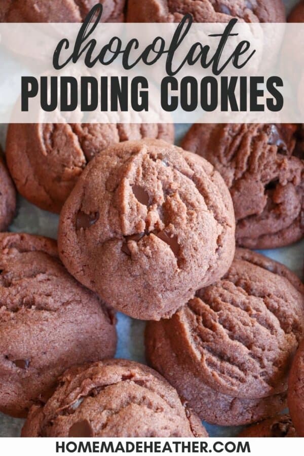 Baked chocolate cookies on a parchment paper lined baking sheet.
