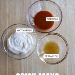 Ingredients for spicy mayo in clear glass bowls o a wooden table.