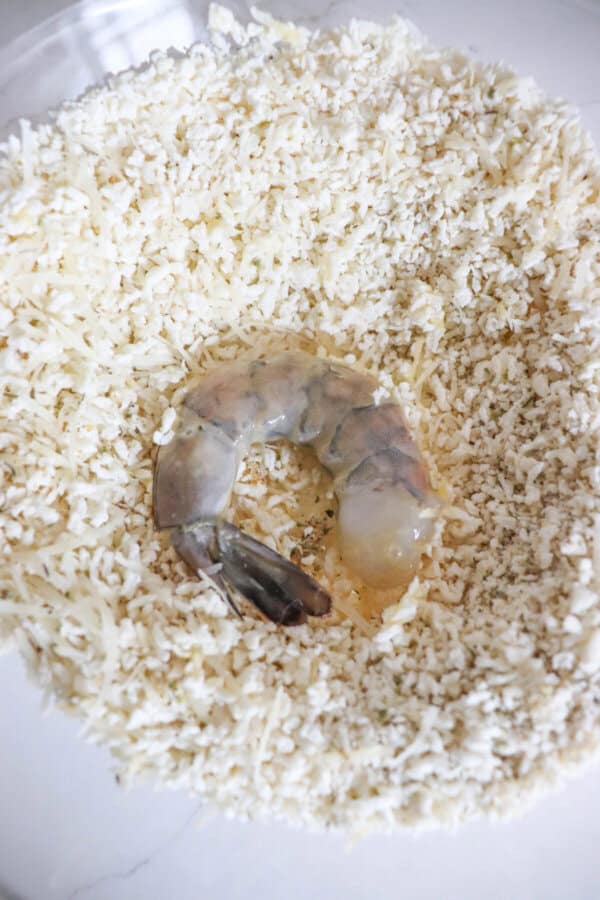 One raw jumbo shrimp in Panko breadcrumb mixture.