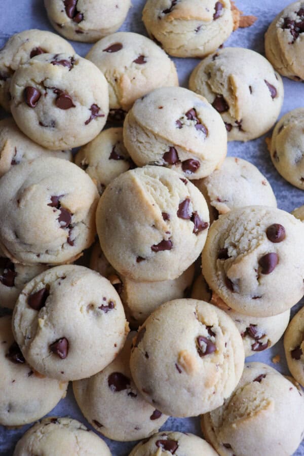 Chocolate chip cookies piled on top of each other.