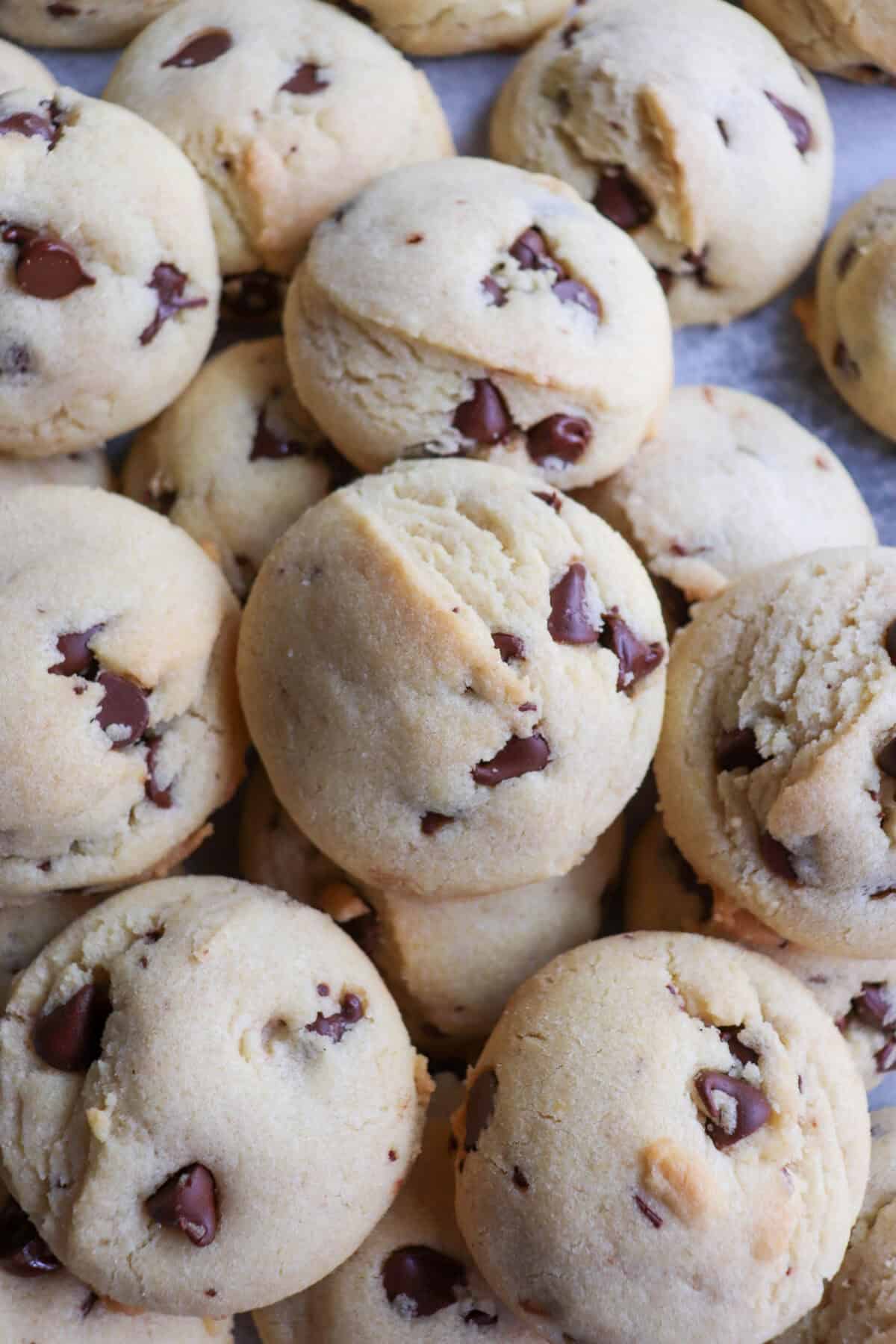 Chocolate chip cookies piled on top of each other.