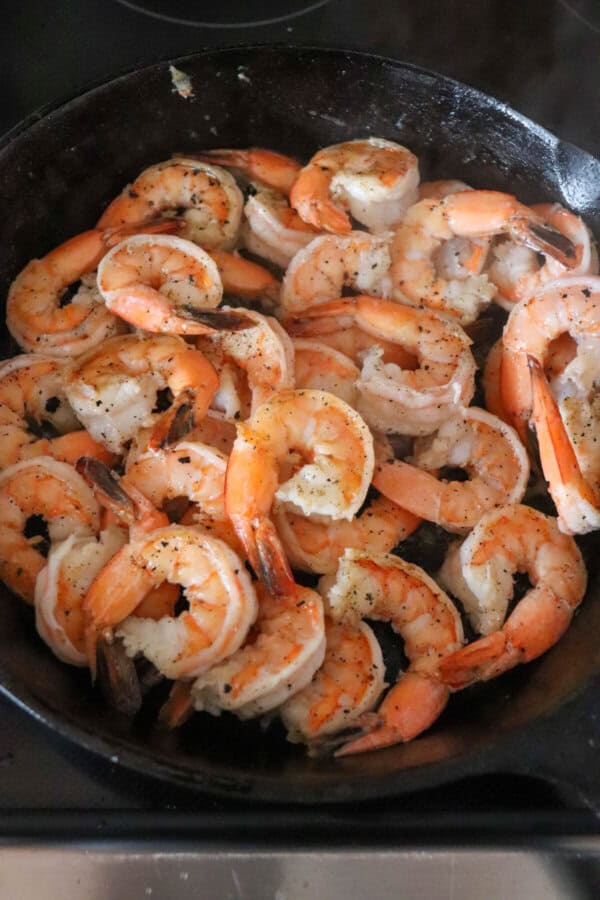 Cooked shrimp in a cast iron skillet.