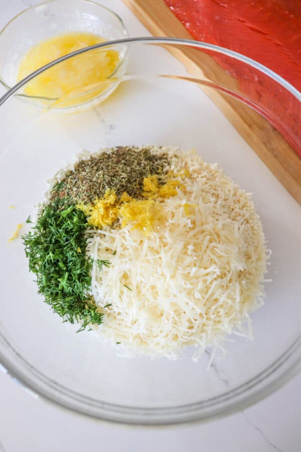 Ingredients for herb crusted salmon in a clear bowl.