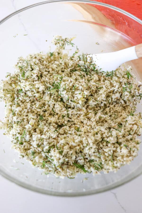Herb breadcrumb mixture for salmon in a glass bowl.