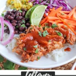 Pulled pork and vegetables over rice in a large white bowl topped with barbecue sauce.