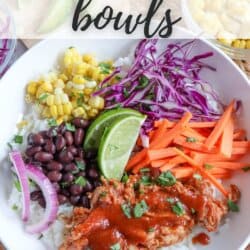 Pulled pork and vegetables over rice in a large white bowl topped with barbecue sauce.