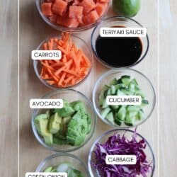 Ingredients for Teriyaki salmon rice bowls in clear glass bowls on a wooden table.