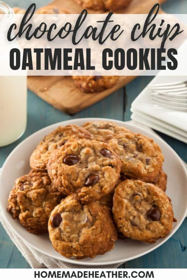 Oatmeal chocolate chip cookies stacked on a white plate.