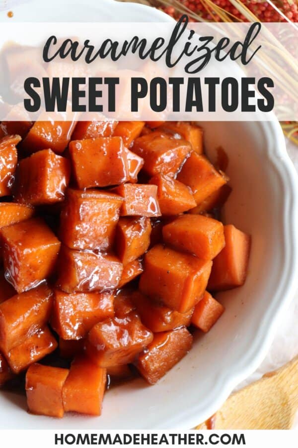 Sweet potatoes covered in a brown sugar glaze in a large white bowl.