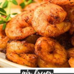 Seasoned shrimp piled on a white plate.