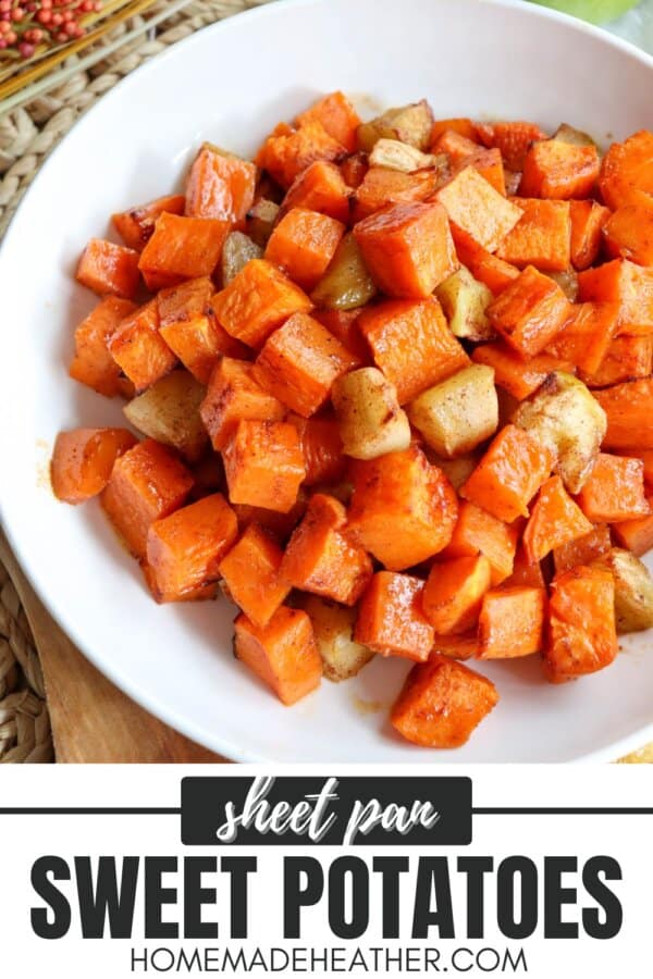 Cooked sweet potato and apple cubed covered in cinnamon in a large white bowl.