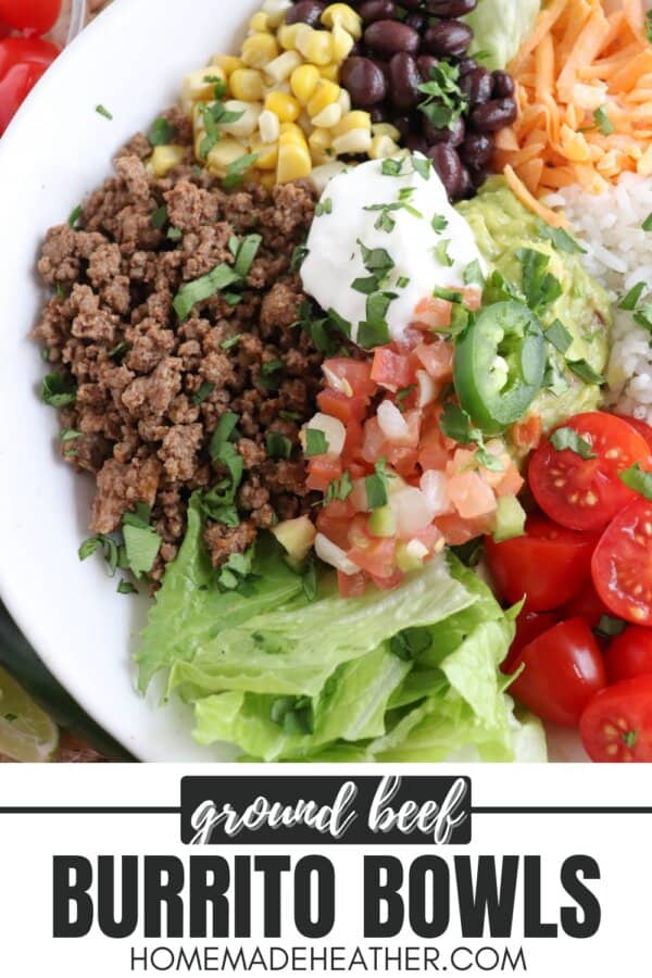 Large white bowl filled with cooked ground taco beef, rice, pico, corn, beans, cheddar cheese and cherry totmatoes, topped with guacamole and sour cream.