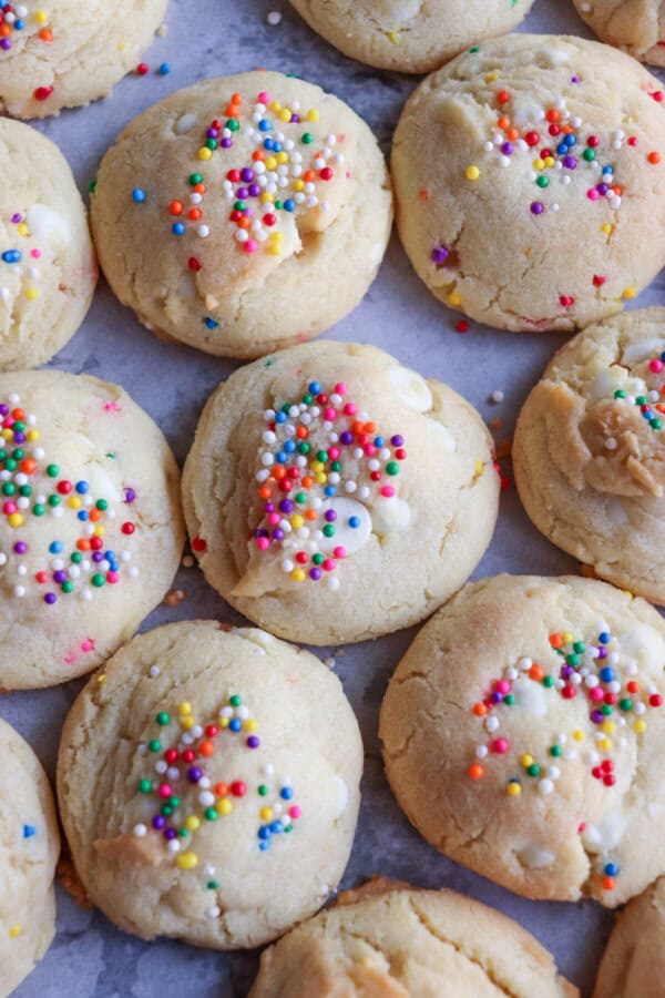 White pudding cookies with rainbow sprinkles.