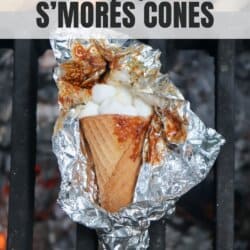 Sugar cone topped with chocolate and marshmallows wrapped in foil.