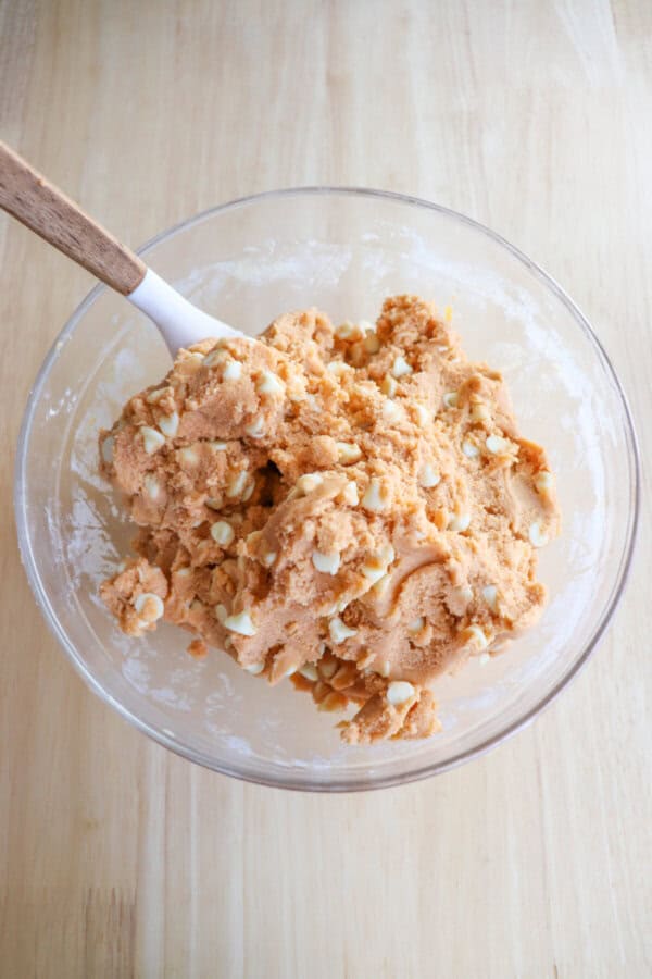 Butterscotch pudding cookie dough in a clear glass bowl.