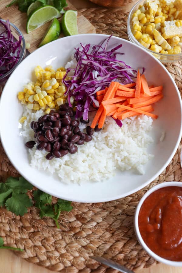 Rice and vegetables in a large white bowl.