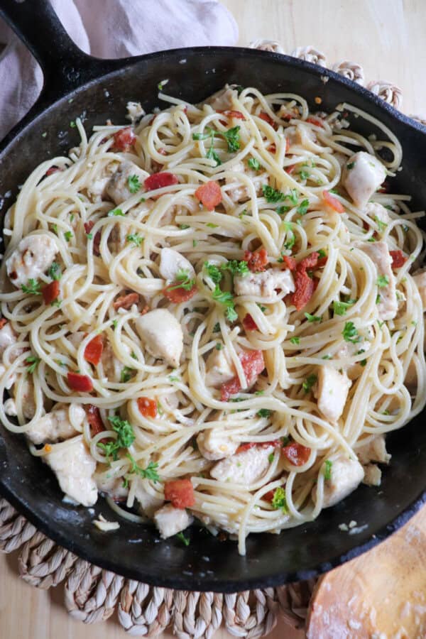 Chicken spaghetti in a cast iron skillet.