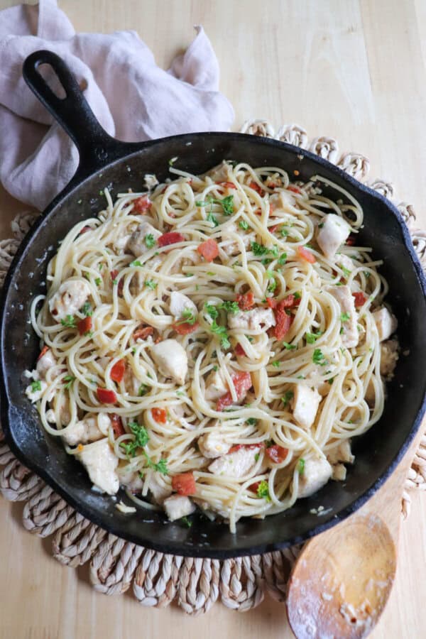 Chicken spaghetti in a cast iron skillet.