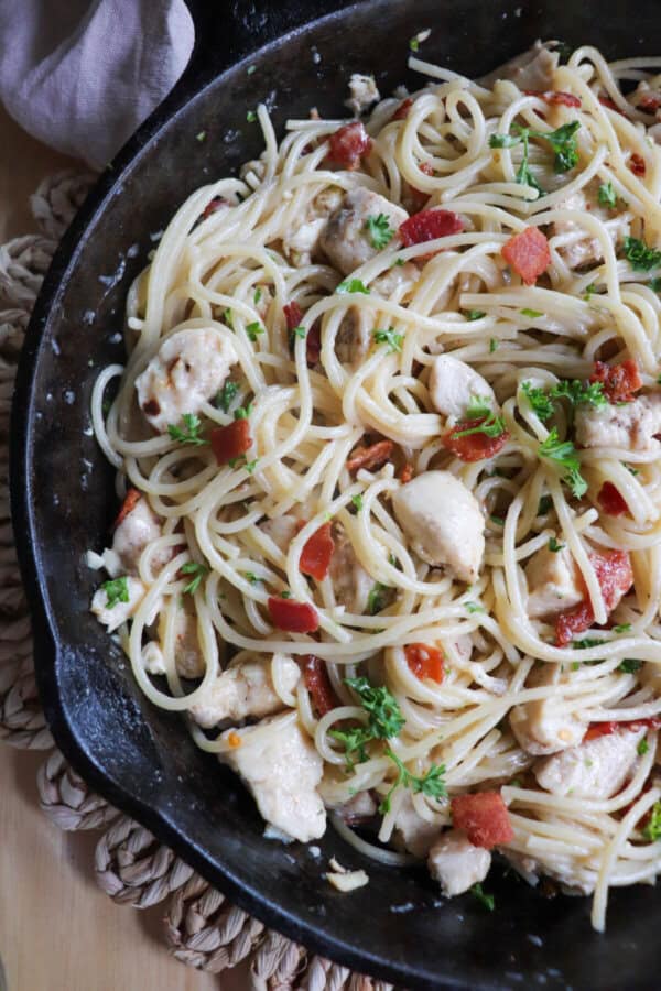Chicken spaghetti in a cast iron skillet.