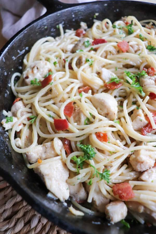 Chicken spaghetti in a cast iron skillet.