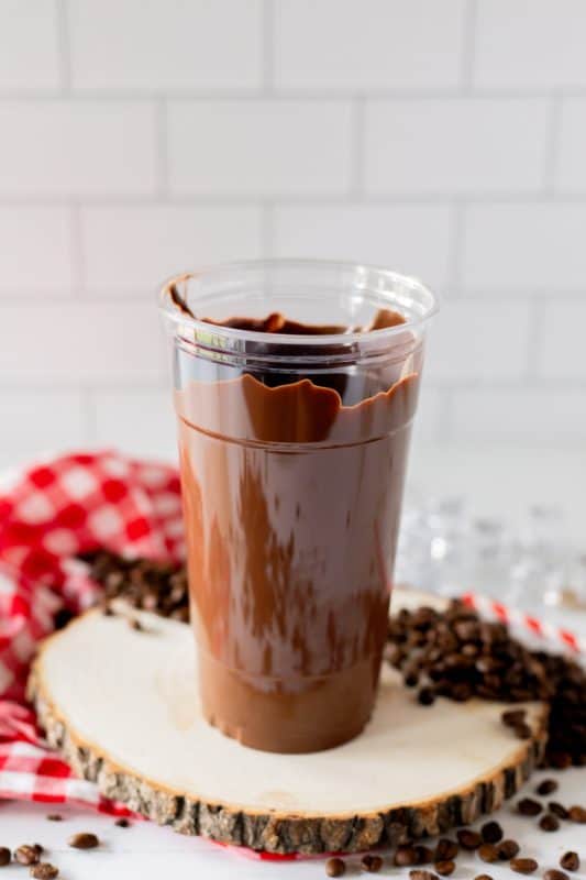 Plastic cup with chocolate coating the inside.