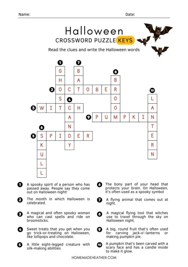 Halloween crossword printables on a white flat lay.
