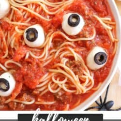 Spaghetti in a white bowl with mozza eyes.