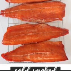 Salmon fillets being cold smoked in a vertical smoker.