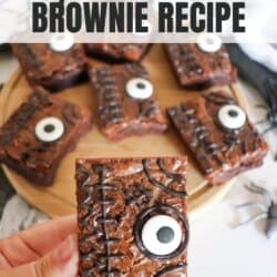 Brownies decorated as a spell book from Hocus Pocus on a wooden cutting board.
