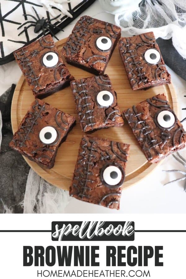 Brownies decorated as a spell book from Hocus Pocus on a wooden cutting board.