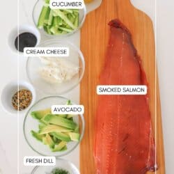 Ingredients for smoked salmon roll ups in clear glass bowls on a white surface.